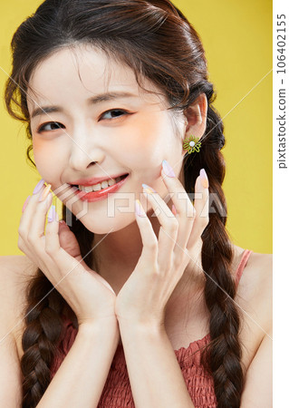 beauty concept photo of korean asain beautiful woman smiling while touching her face beauty concept photo of korean asain beautiful woman smiling while touching her face 106402155