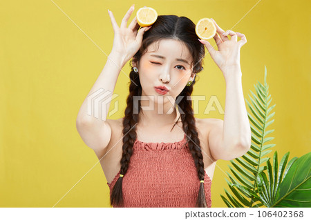 beauty concept photo of korean asain beautiful woman with lemons 106402368