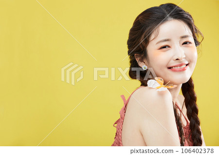 beauty concept photo of korean asain beautiful woman with a butterfly on her shoulder, smiling beauty concept photo of korean asain beautiful woman with a butterfly on her shoulder, smiling 106402378
