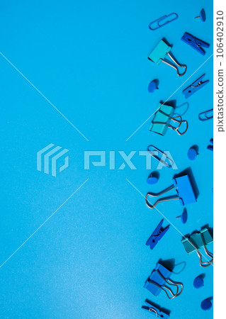 Monochromatic Frame border made of school stationery supplies. Copy space for your text or Educational greeting announcement for students and teacher. Creative vivid blue background. Concept of new 106402910