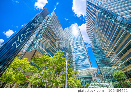 Tokyo cityscape in Japan: View of Tokyo Midtown and other areas reflected in green trees = August 25th 106404451