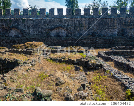 Ruin of an old castle. Remains of civilization. Fortress in Georgia. The city of ancient stone masonry. Site of archaeological finds Ruin of an old castle. Remains of civilization. Fortress in Georgia. The city of ancient stone masonry. Site of archaeological finds 106404482