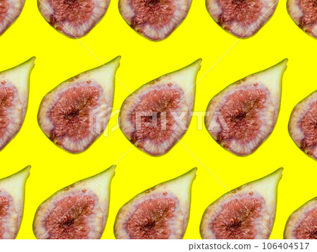 Pattern of sliced figs. Juicy ripe fruit on a yellow background. Diet food. Fig isolate. Seeds inside. Bright picture. 106404517