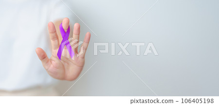 Woman holding purple Ribbon for Violence, Pancreatic, Esophageal, Testicular cancer, Alzheimer, epilepsy, lupus, Sarcoidosis and Fibromyalgia. Awareness month and World cancer day concept Woman holding purple Ribbon for Violence, Pancreatic, Esophageal, Testicular cancer, Alzheimer, epilepsy, lupus, Sarcoidosis and Fibromyalgia. Awareness month and World cancer day concept 106405198