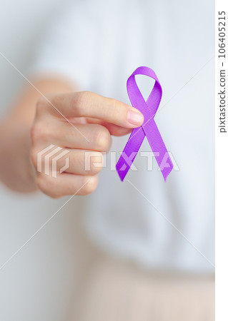 Woman holding purple Ribbon for Violence, Pancreatic, Esophageal, Testicular cancer, Alzheimer, epilepsy, lupus, Sarcoidosis and Fibromyalgia. Awareness month and World cancer day concept 106405215
