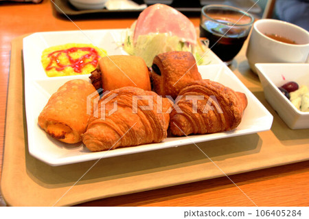 Simple breakfast with various types of bread, morning bread buffet, scrambled eggs 106405284