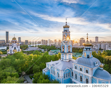 Summer Yekaterinburg, Temple of the Ascension and Temple on Blood in beautiful clear sunset. Summer Yekaterinburg, Temple of the Ascension and Temple on Blood in beautiful clear sunset. 106405329