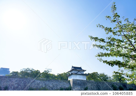 Inui turret and small castle tower seen through fresh greenery 106405885