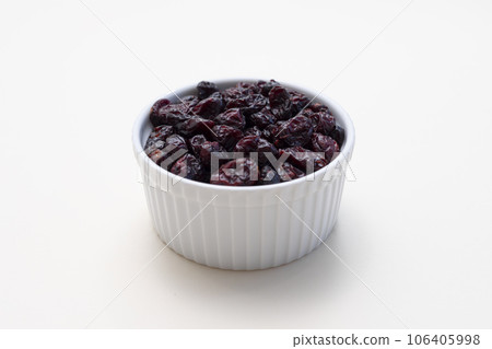 Isolated Superfood, Dried Cranberries In White Bowl On White Background. Sweet Dehydrated Cranberries, Berry. Nutrients And Vitamins. Horizontal Plane. Isolated Superfood, Dried Cranberries In White Bowl On White Background. Sweet Dehydrated Cranberries, Berry. Nutrients And Vitamins. Horizontal Plane. 106405998