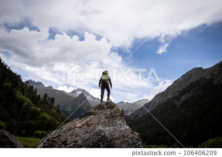 Hiking woman in high altitude mountains 106406209