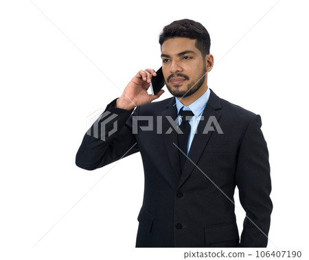 Portrait of a professionally dressed man engrossed in a phone conversation, exhibiting a sense of business and urgency. Portrait of a professionally dressed man engrossed in a phone conversation, exhibiting a sense of business and urgency. 106407190