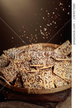 Crackers with sunflower seeds and flax seeds. 106407880