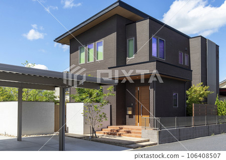 Exterior and sky of a house with a carport Exterior and sky of a house with a carport 106408507