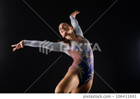 Dancing flying girl, jumping in studio shooting, sport and dance 106411691