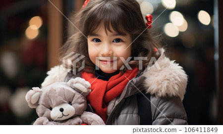 Girl overjoyed after receiving a present 106411849