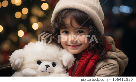 Girl overjoyed after receiving a present 106411850