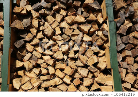 Firewood dried and stored in the firewood shelf Firewood dried and stored in the firewood shelf 106412219