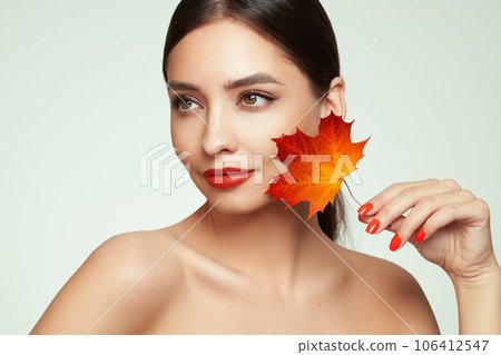 Autumn portrait of beautiful woman with clean fresh skin Autumn portrait of beautiful woman with clean fresh skin 106412547