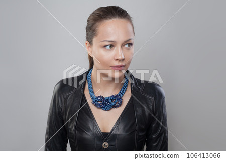 Perfect blue necklace on neck of brunette model woman Perfect blue necklace on neck of brunette model woman 106413066