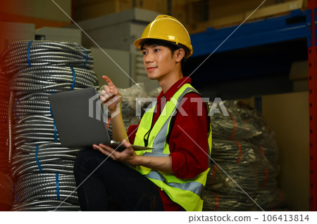 Asian man warehouse worker in reflective jackets using digital tablet, checking stock and order details in warehouse Asian man warehouse worker in reflective jackets using digital tablet, checking stock and order details in warehouse 106413814