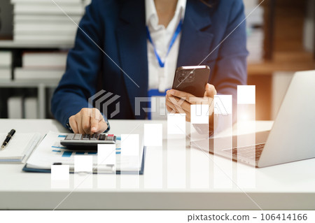 Investors are calculating on calculator investment costs and holding tablet and computer in hand at home office. Investors are calculating on calculator investment costs and holding tablet and computer in hand at home office. 106414166