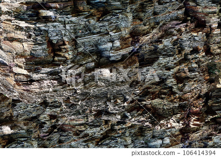 Stone gray brown crumbling rock formation background 106414394