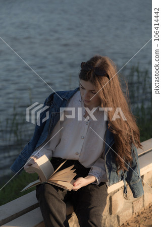 Portrait of a beautiful girl with a book. 106414442