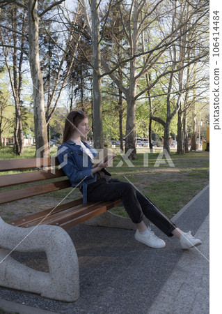 Portrait of a beautiful girl with a book. 106414484