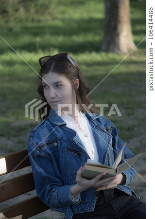 Portrait of a beautiful girl with a book. 106414486