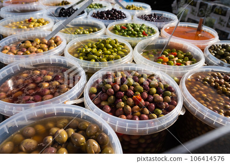 Pickled olives of different varieties at the bazaar. 106414576