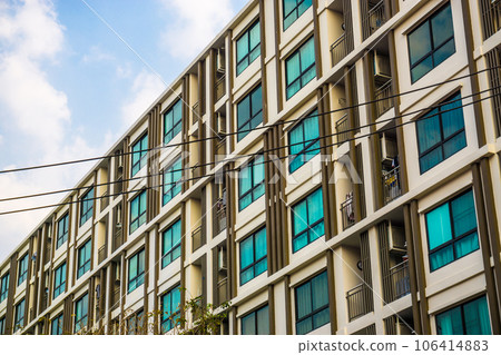Modern condominium window building against blue sky city resident Modern condominium window building against blue sky city resident 106414883