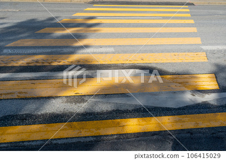 Temporary Pedestrian Crossing, Yellow Crosswalk, Safety Zebra on Modern Tiles Pathway Temporary Pedestrian Crossing, Yellow Crosswalk, Safety Zebra on Modern Tiles Pathway 106415029