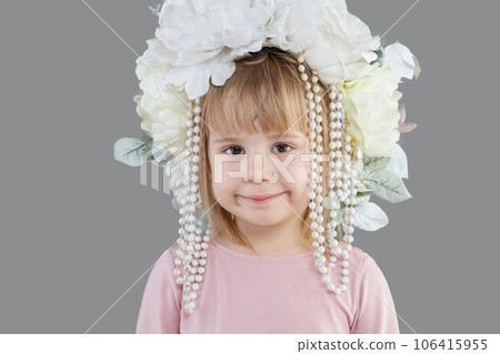 Cheerful smiling child baby girl in white flower hat closeup portrait 106415955