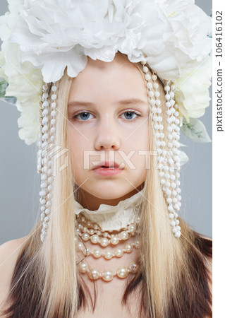 Young pretty girl in white spring flower wreath, close up beauty portrait Young pretty girl in white spring flower wreath, close up beauty portrait 106416102