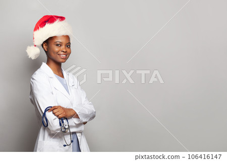 Cheerful Christmas woman doctor Santa on white background Cheerful Christmas woman doctor Santa on white background 106416147