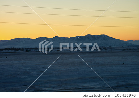 Mongolian steppe in winter during sunset. Mongolian steppe in winter during sunset. 106416976
