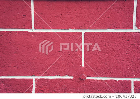 Brick wall made of decorative plaster of red color. Retro-vintage style. Color interior design. With space to copy. High quality photo Brick wall made of decorative plaster of red color. Retro-vintage style. Color interior design. With space to copy. High quality photo 106417325