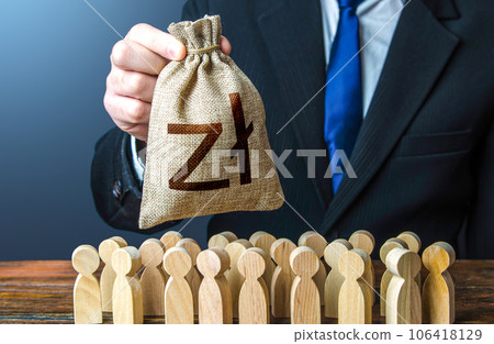Businessman holds out a polish zloty money bag to the crowd. Compensation payments. Providing money, paying salaries and grants. Financial support. Tax collection. Staff maintenance. Businessman holds out a polish zloty money bag to the crowd. Compensation payments. Providing money, paying salaries and grants. Financial support. Tax collection. Staff maintenance. 106418129