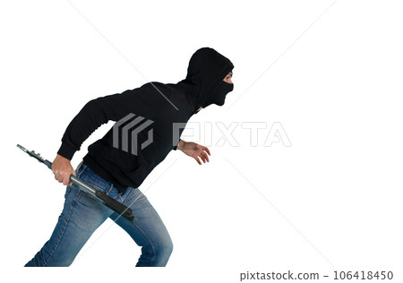 Thief with balaclava acts in silence to steal apartments with wire cutters in hand Thief with balaclava acts in silence to steal apartments with wire cutters in hand 106418450