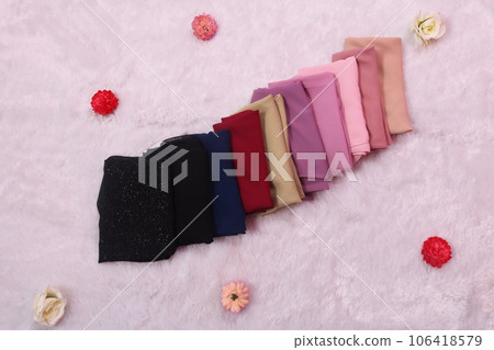folded hijab on white background. scarf for muslim women fashion. 106418579