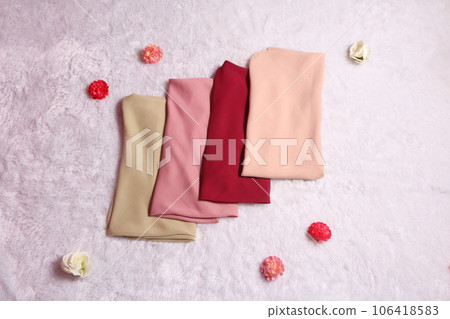 folded hijab on white background. scarf for muslim women fashion. 106418583
