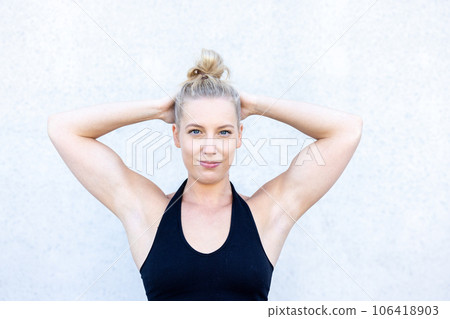 Blissful Stretching: Relaxed Blonde Woman 106418903