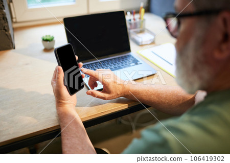 Senior businessman using mobile phone for communication and work. Modern technologies in professional sphere Senior businessman using mobile phone for communication and work. Modern technologies in professional sphere 106419302