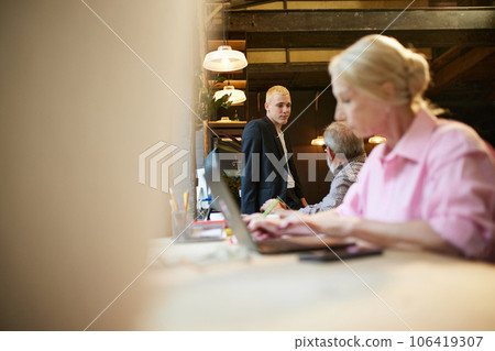 Working atmosphere in modern office. Business people, young and senior colleagues working on projects together 106419307