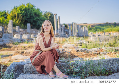 Pretty tourist woman at the ruins of ancient city of Perge near Antalya Turkey Pretty tourist woman at the ruins of ancient city of Perge near Antalya Turkey 106423272