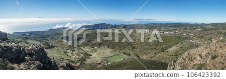 Panoramic view from peak of Alto de at Garajonay mountain with forest and hills, Garajonay National Park, La Palma island and small villages. La Gomera, Canary Islands, Spain. 106423392