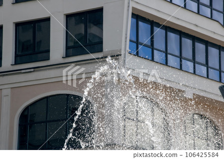 High jets of water fountain in the city High jets of water fountain in the city 106425584