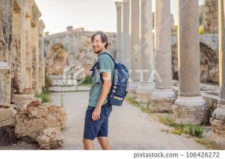 Tourist man at the ruins of ancient city of Perge near Antalya Turkey 106426272