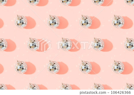 Creative Christmas pattern with shiny disco balls on pink. Retro party time concept. 106426366