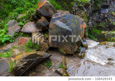 Wet stones at Honey waterfalls 106426543